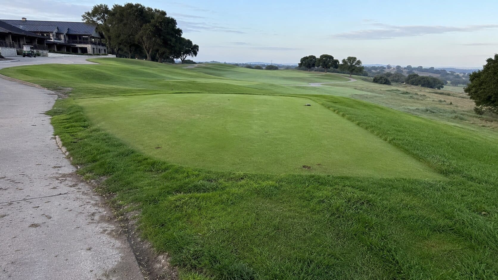 Quiet morning view across a golf course lawn